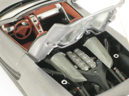 Engine cover opened to show 12 cylinder engine in Porsche Carrera GT model car from Tamiya