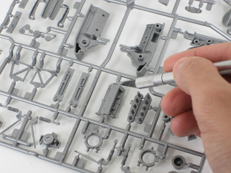 removing model car parts from sprues with a hobby knife